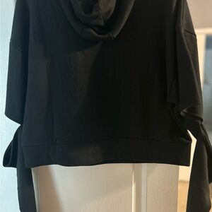 Black, hooded Alo Yoga sweatshirt. Extra long sleeves. Slit around elbows.